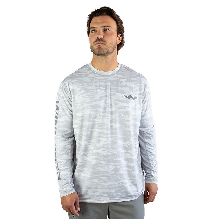 Man in white snowy tundra sol invictus pro shirt front studio view against white background
