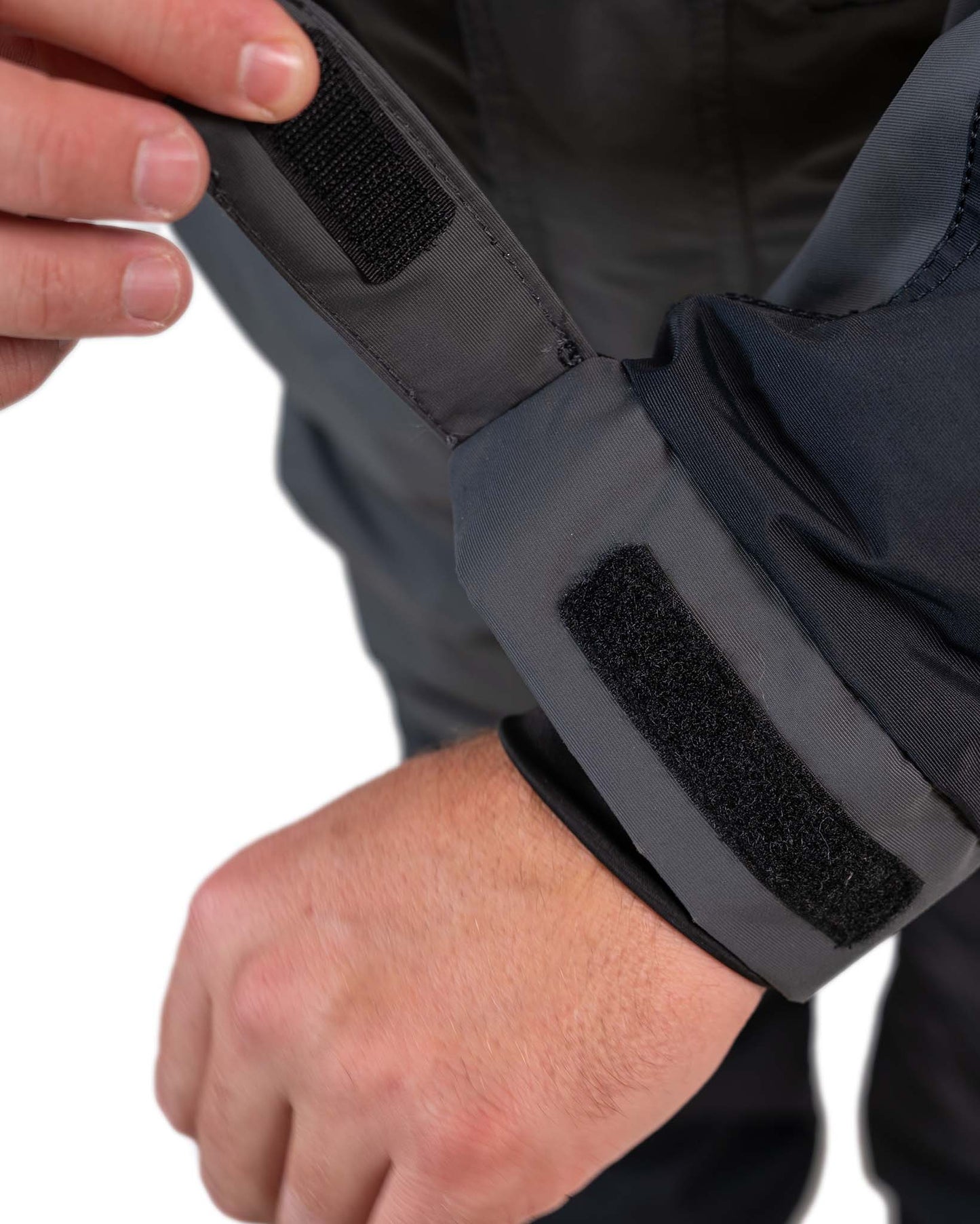 Detail of grey and navy blue ice gear gear showing waterproof construction and features