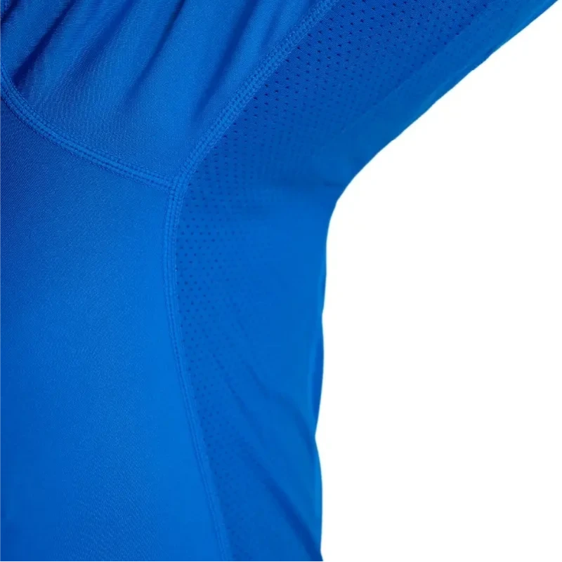 Detail close-up of royal blue shirt shoulder and upper chest construction