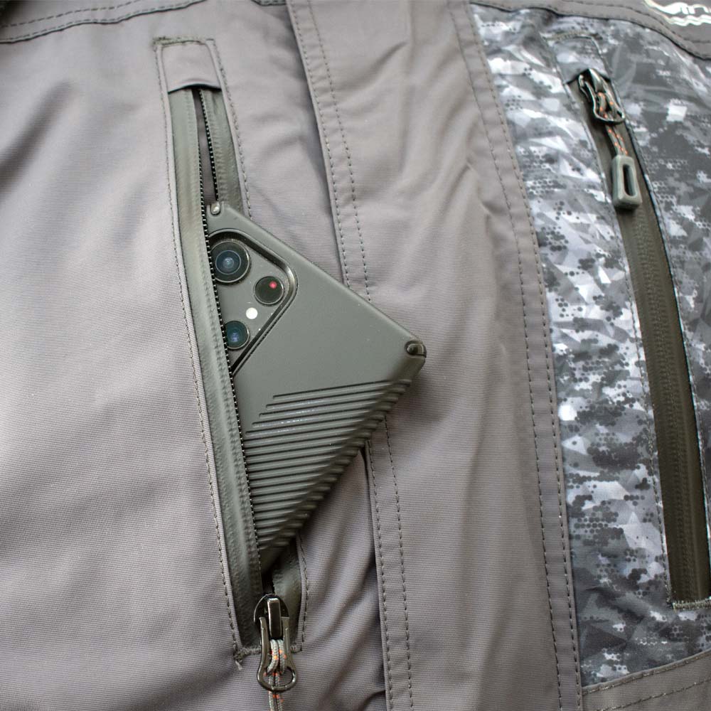 Detail view of charcoal grey ice gear jacket showing insulation and pocket features