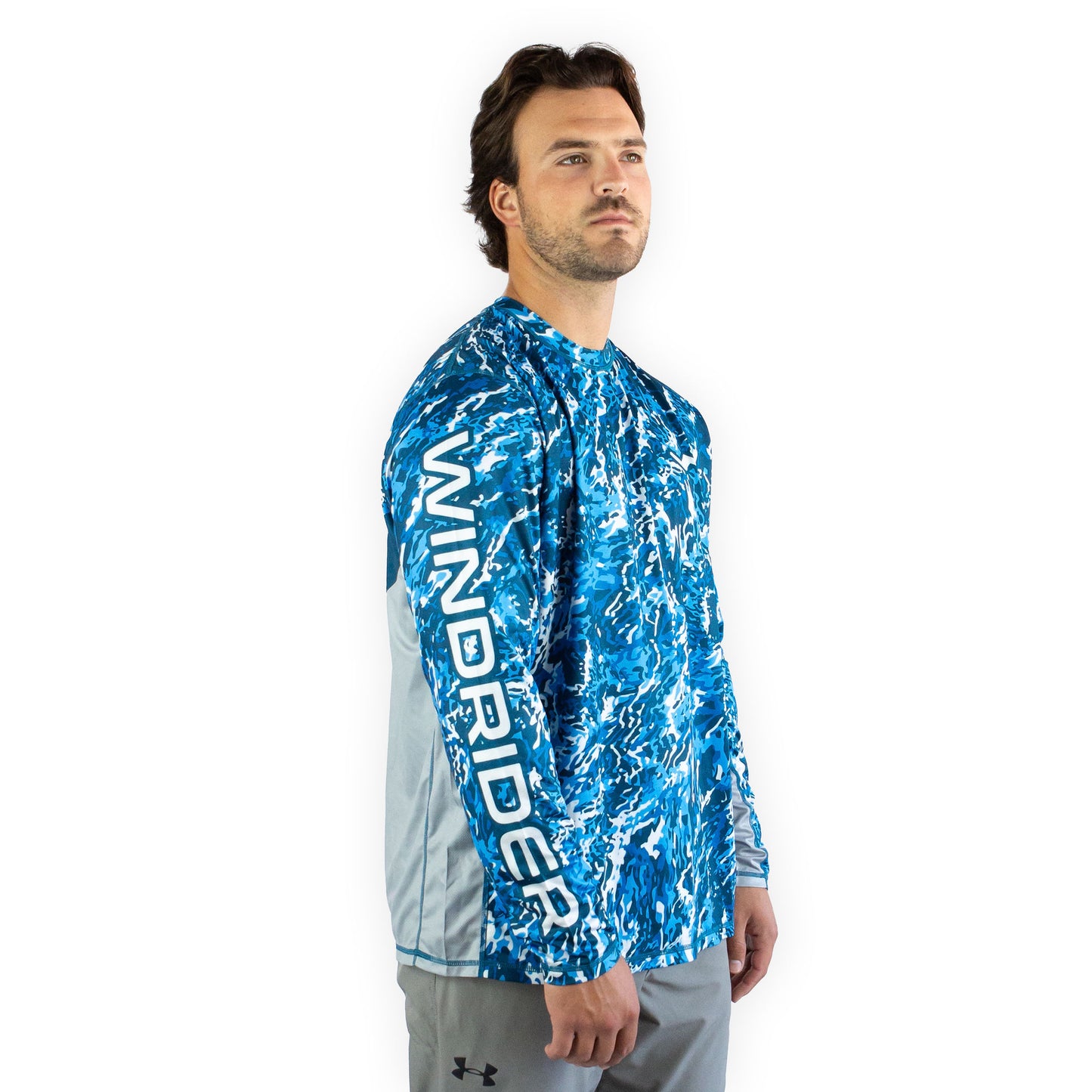 Man in blue camo sol invictus pro shirt studio portrait full body view mesh panels visible