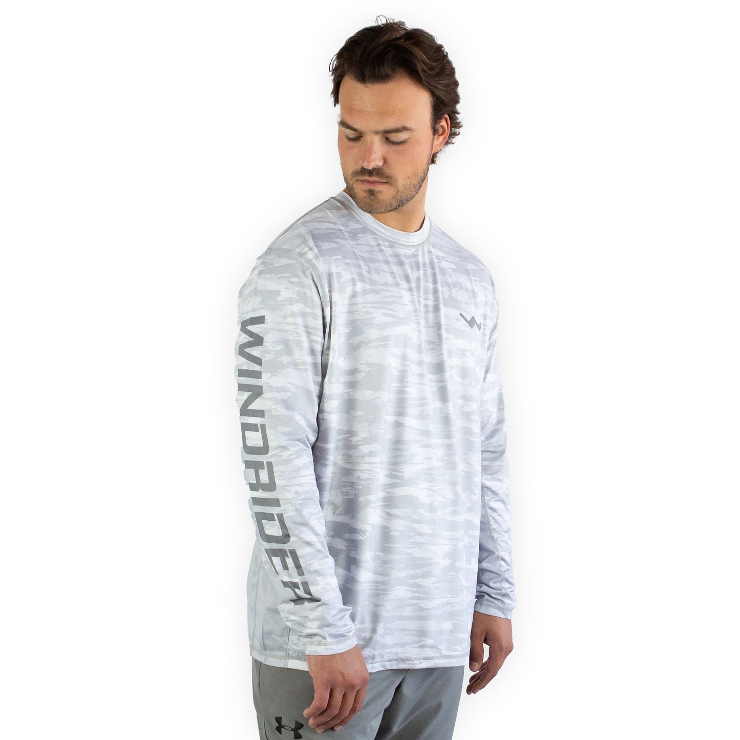Man in white snowy tundra sol invictus pro shirt studio shot showing ventilation mesh detail
