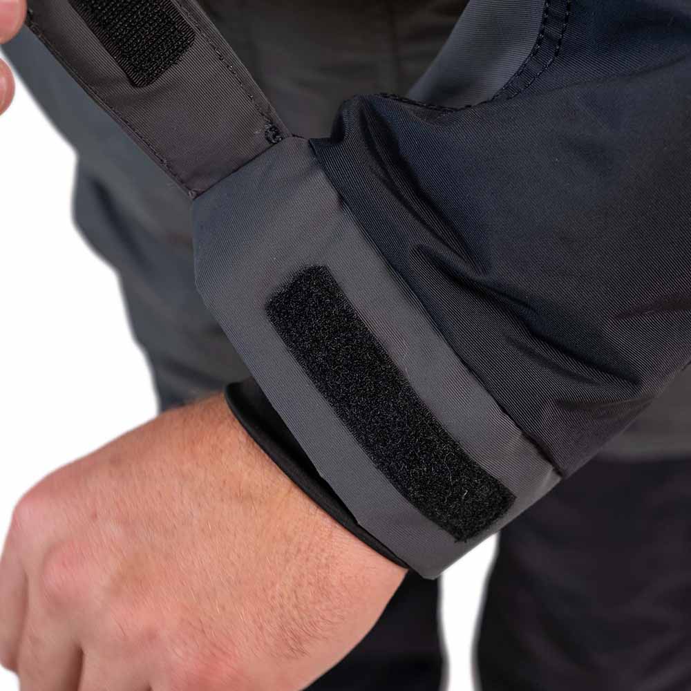 Detail of grey and navy blue ice gear gear showing waterproof construction and features