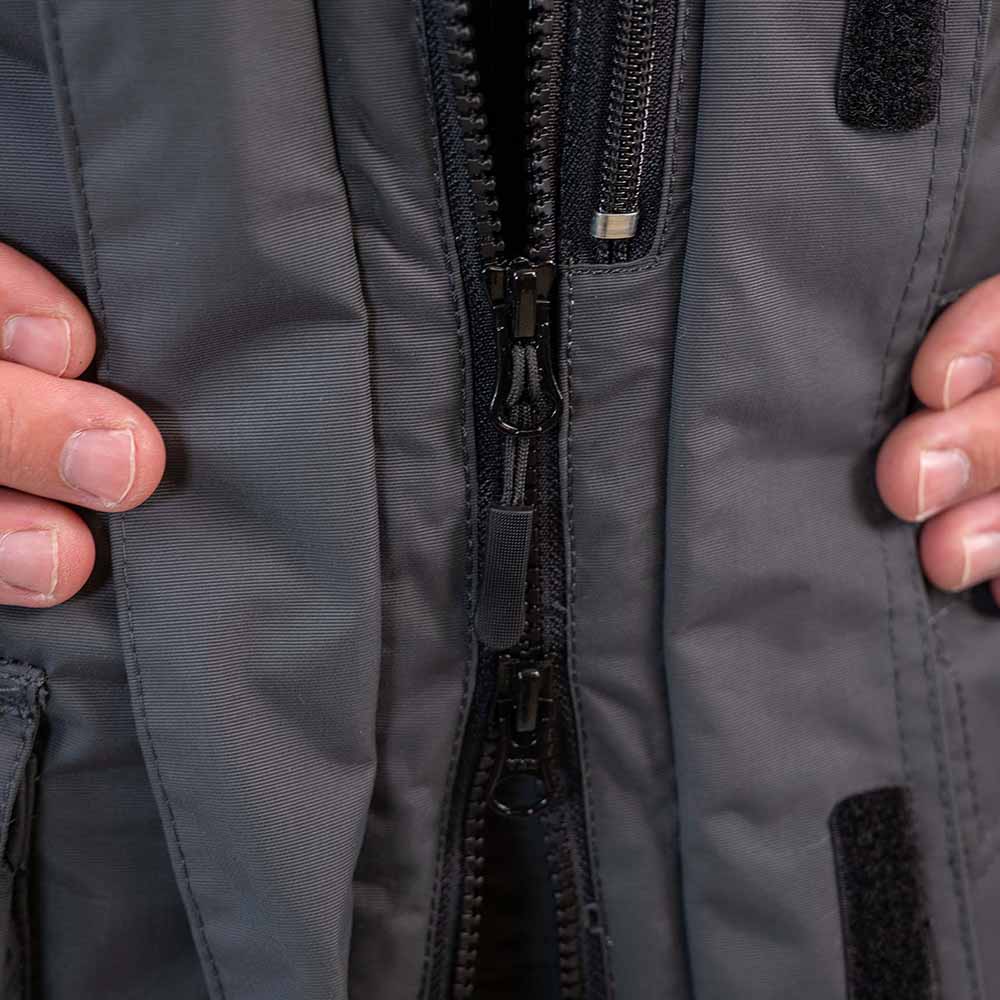 Grey and navy blue ice gear jacket detail showing durable construction