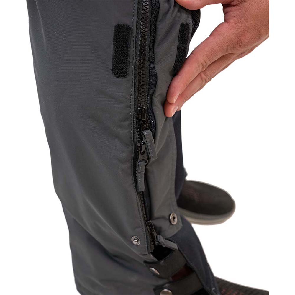 Grey and navy blue waterproof ice gear bibs showing functional design features