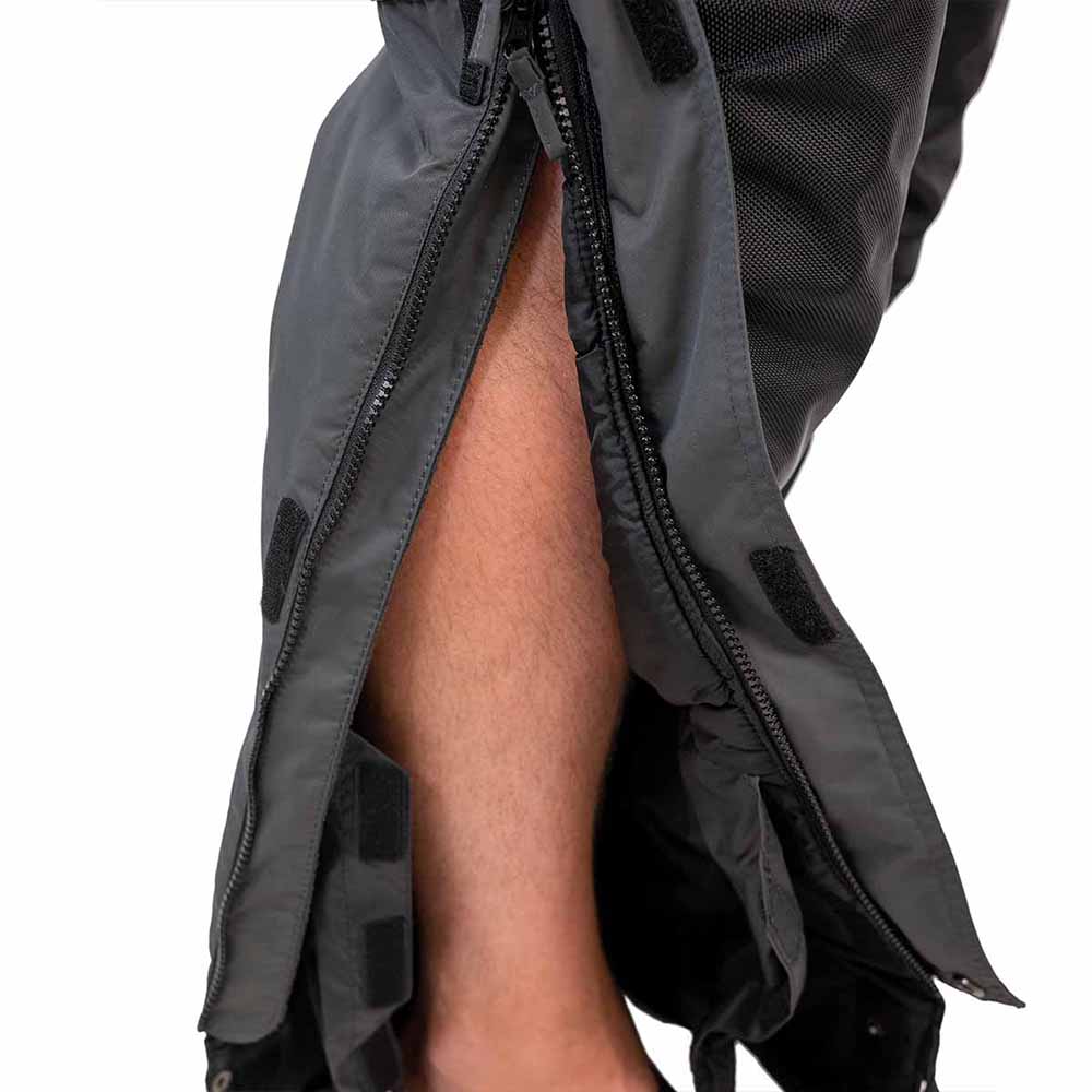 Grey and navy blue waterproof ice gear bibs showing functional design features