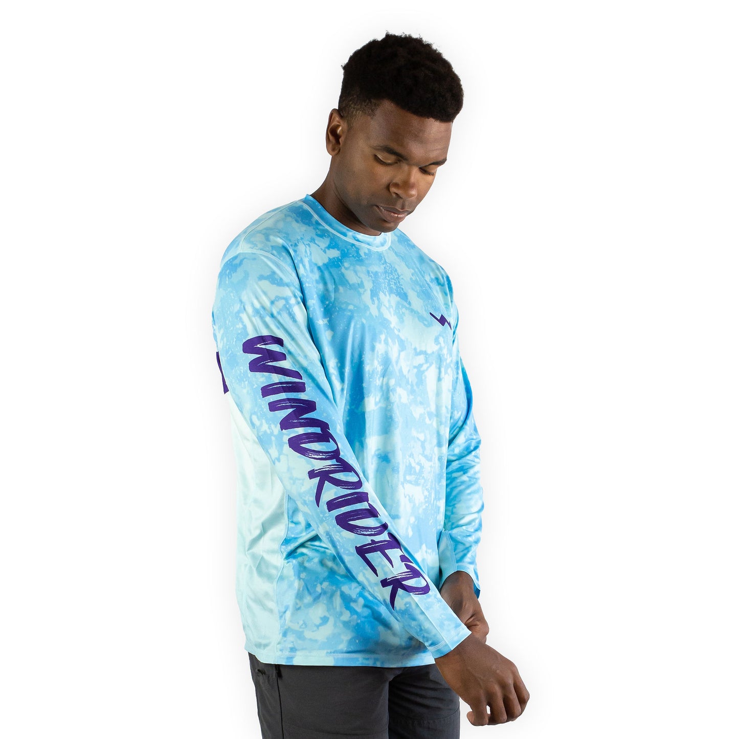 Man in caribbean cove blue sol invictus pro shirt studio portrait full body front view
