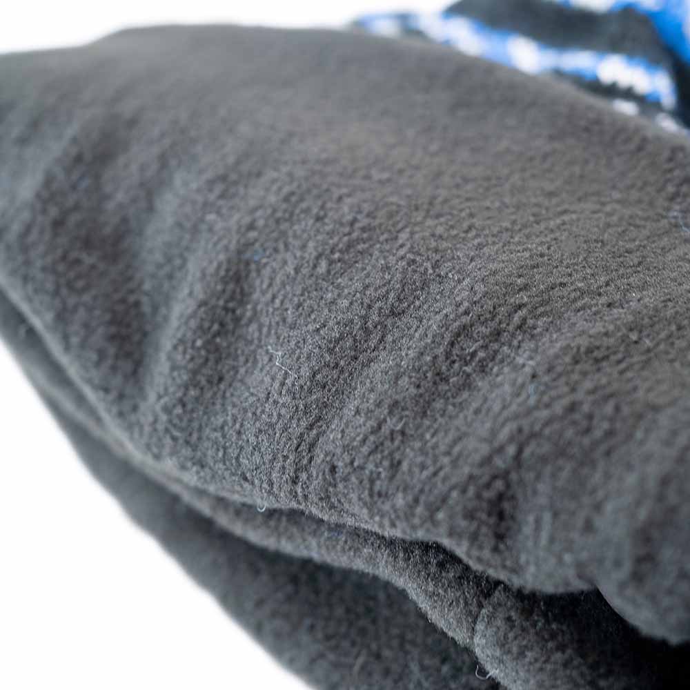 Three-quarter view of insulated ice gear jacket with hood and storm flaps