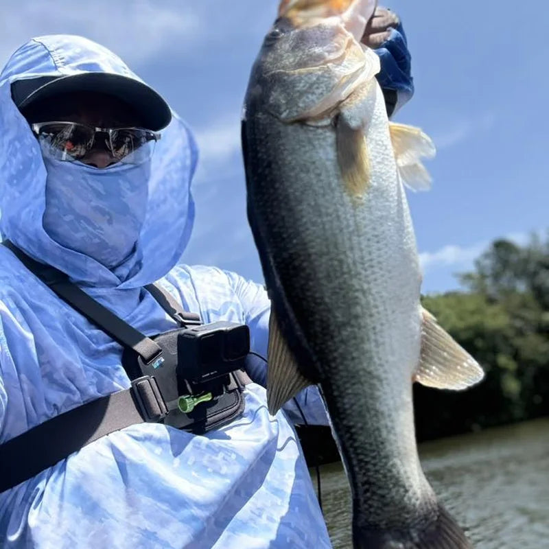 Person wearing hooded UPF 50+ sun shirt with face gaiter for full sun protection outdoors