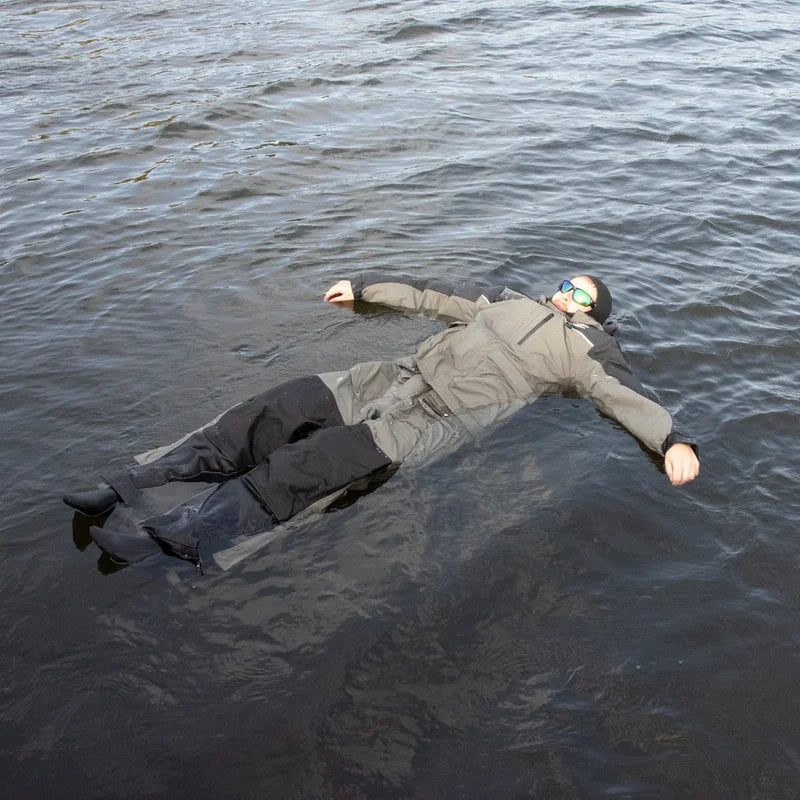 Ice fishing float suit demonstration showing buoyancy assist technology keeping angler afloat