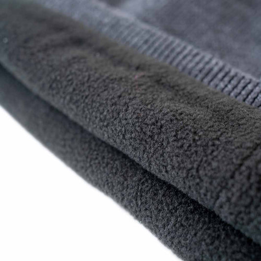 Detail view of insulated ice gear jacket showing insulation and pocket features
