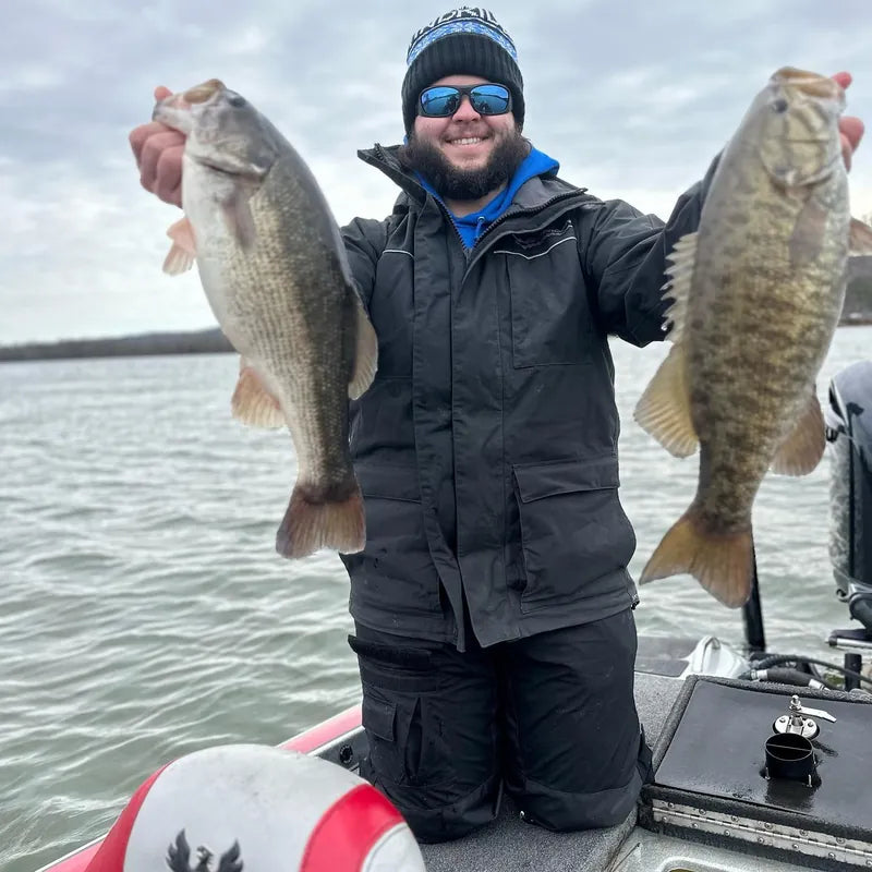 Successful angler with catches wearing WindRider rain gear