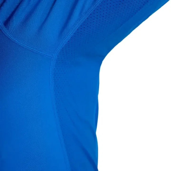 Close-up of the real Helios underarm mesh ventilation panel and flat seams.